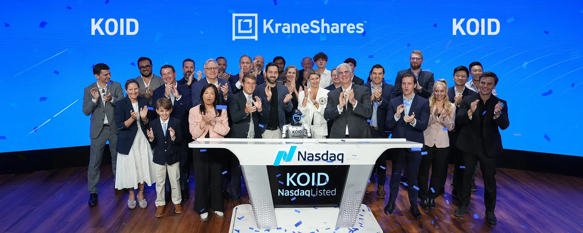 KraneShares team ringing the Nasdaq bell with KOID branding, celebrating the Launch of the girst global humanoid & embodied intelligence ETF